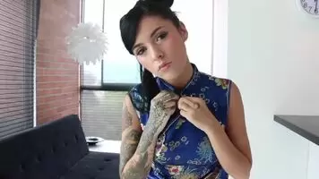 Breasts bursting from a Chinese dress