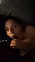 Sucking on a long black cock
