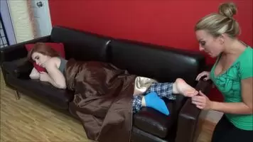 Tasting her friend's feet
