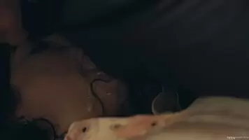 On her back