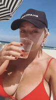 Caroline drinking at beach
