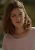 Stripping off her shirt and getting wet
