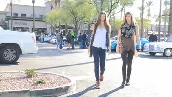 Two Girls Showing Their Assets In A Parking Lot
