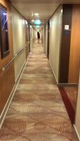 Sexy beauty in high heels runs down the hall of the hotel and shows ass!