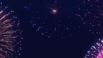 Two girls were doing it while watching fireworks. Another girl was watching them.