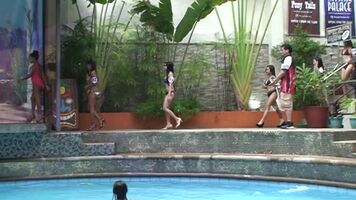 Filipina bar girls on parade at pool party in bikinis
