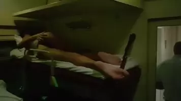 The Girl is Naked on the Train, and People are Standing Nearby