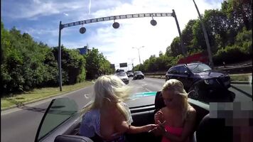 Two blondes on the road with boobs out