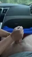 Two-handed handjob in the car