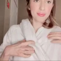 Sit down while I take off my robe for you.