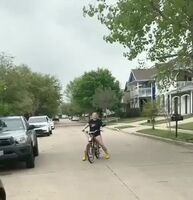 Drive-by ass shake. Big booty swerving on a bike