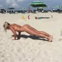 Swedish fitness model Katarina Konow does some casual resistance training at the beach